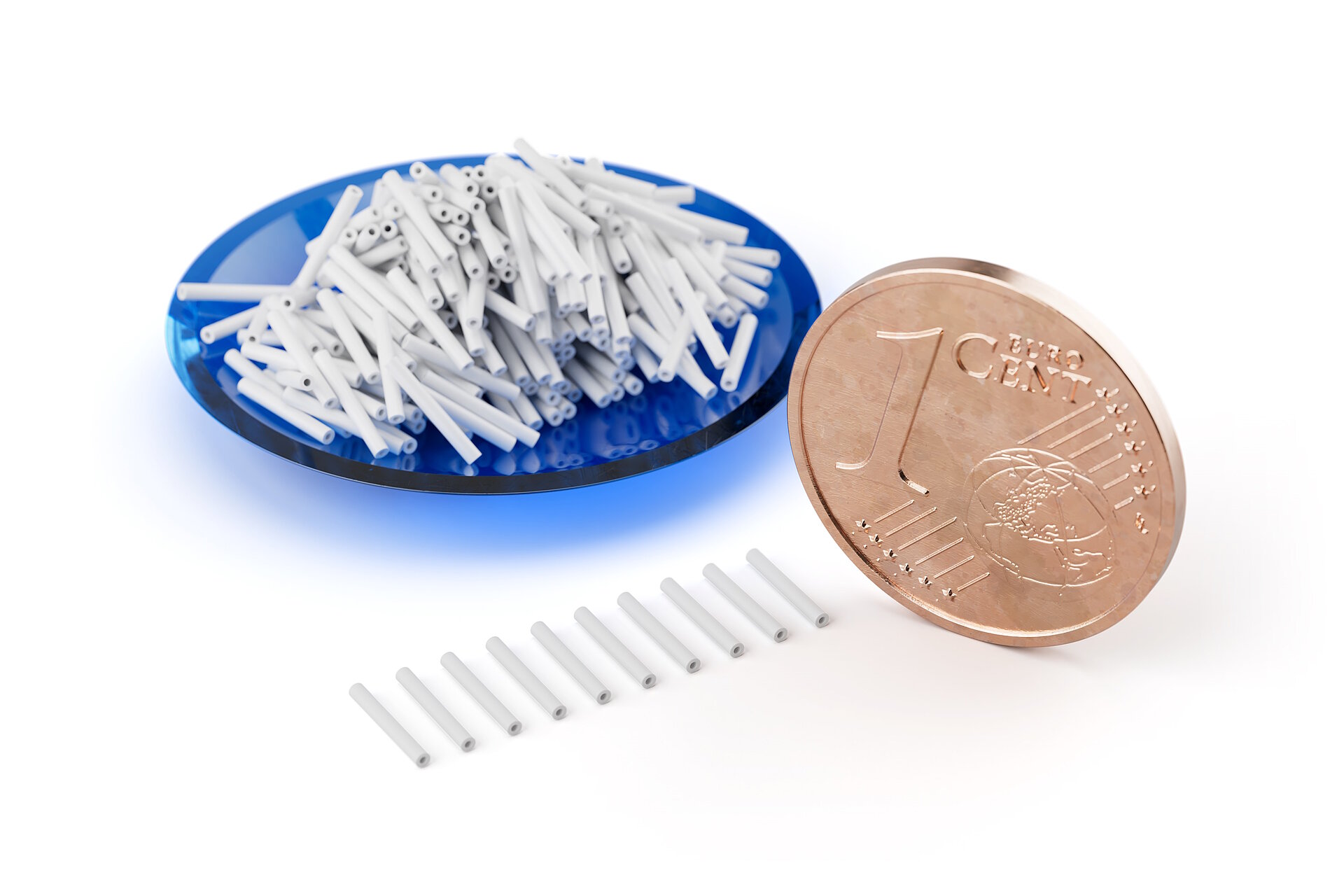 Tubes made of structural ceramics next to cent coin